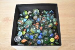 A box of vintage glass marbles.