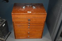 An early 20th Century mahogany dentist's or collectors chest, having a lift up lid with six