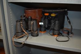 Two pairs of vintage binoculars, Cumbria Deluxe and Denhill Deluxe, with leather cases