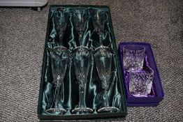 A box of six Thomas Webb crystal glass champagne flutes and two Edinburgh Crystal glass tumblers