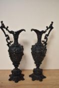 A pair of 20th century cast metal handled urns in the Victorian style.