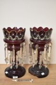 Two Victorian table lustres, ruby glass with enamel and gilt floral decoration.