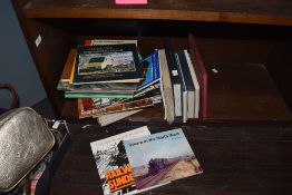 A selection of reading material, to include 'A Brush With Steam' by David Shepherd, and railwayana