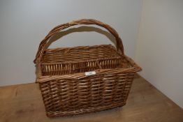 A vintage wicker bottle basket, measuring 42cm x 34cm x 40cm