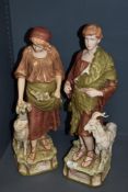 Two Royal Dux figures, girl with sheep and boy with goat, both having pink lozenge.