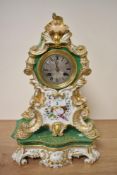 A 19th century French porcelain mantel clock, having gilt and foliate vignette decoration, af.