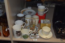 An assorted collection of commemorative ware, to include mugs, tankards, and pepperettes