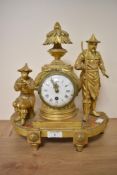 A 19th century gilt mantel clock of colonial interest, decorated with agricultural figures, having
