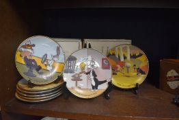 Eight Looney tunes collectors plates, including Buggs Bunny and Daffy.