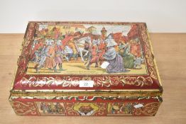 An oversized German tin, decorated with battle scene and historical figures.