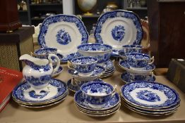 A 19th/20th Century blue and white transfer printed part tea service, the design featuring game