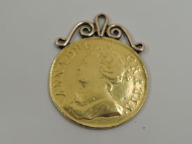 A 1714 Queen Anne Gold Guinea having possible 9ct gold mount attached, total weight approx 9.1g
