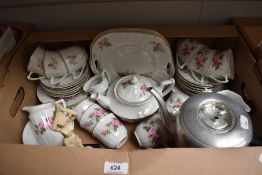 A part tea service in white with pink rose decoration and gilt edging (42 pieces approx), a