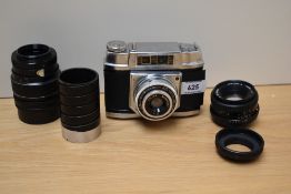 A Halina 6-4 camera with a Halena 1:8 lens along with a Cosina Cosinon-S 50mm 1:2 lens, a Optomax