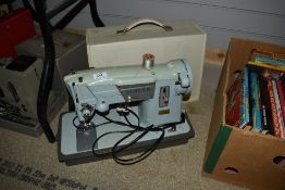 A vintage Singer sewing machine, model number 357K, with case.