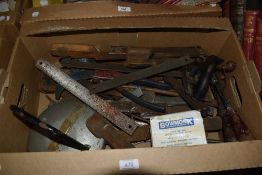 A carton of assorted tools including chizzles, rasps, planes, hand drills and a Bowmont Brakemeter-