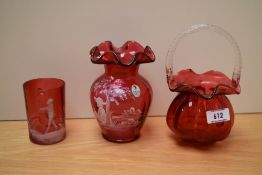 A 20th Century Fenton glass vase, of Mary Gregory style, a cranberry glass mug of similar style, and