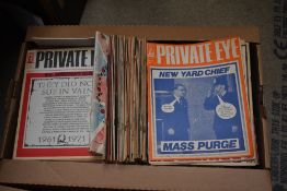 A carton of vintage Private Eye magazines.