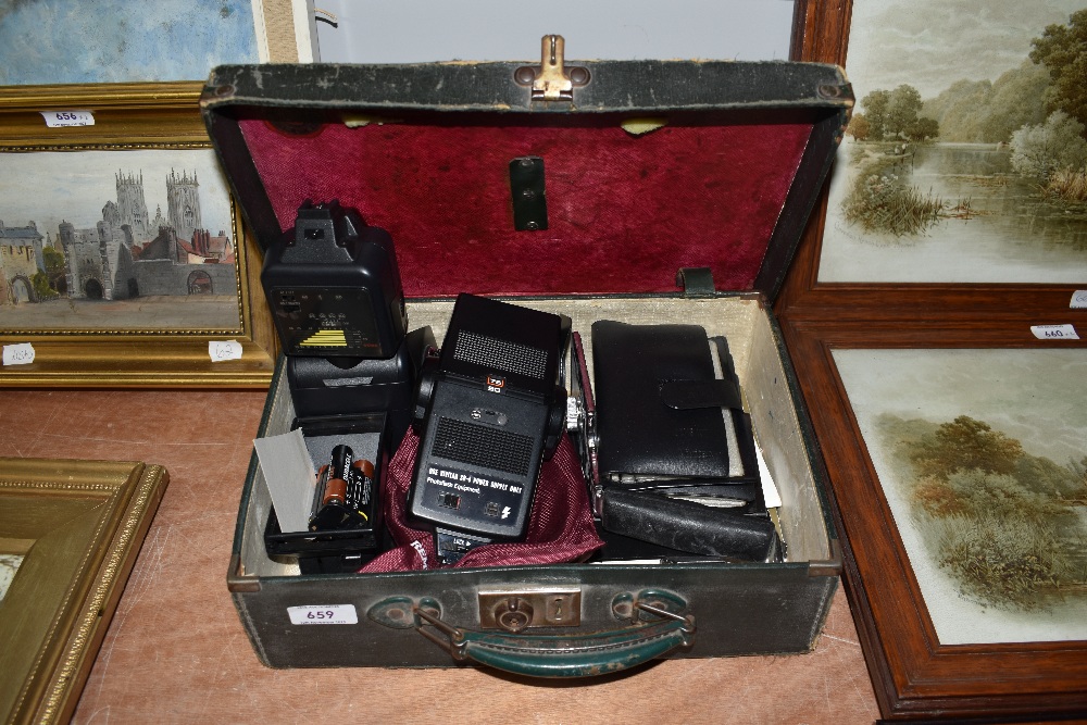 A small case of flash shoes etc.