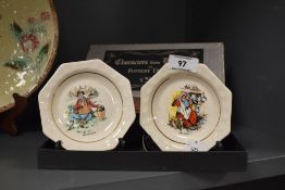 Two Wade pin dishes, with Charles Dickens depictions to centres.