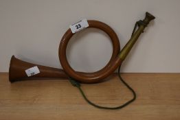 A vintage copper and brass post horn.