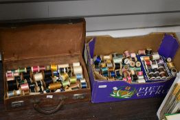A large collection of predominantly vintage spools of thread.