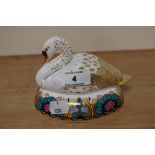 A Royal Crown Derby paperweight in the form of a swan, having silver stopper.