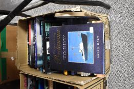 A box of books, of sailing, battleship and boat interest.