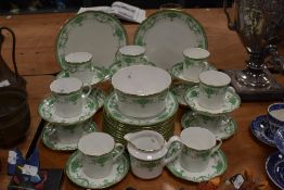 A selection of early 20th century tea service, having white ground with green swag transfer design