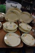 A selection of Art Deco Crown Ducal plates, platters and tureens, having green rim to cream ground