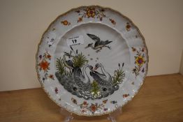 A 20th century plate, having moulded stork and goose decoration,possibly Bavarian or similar.
