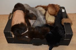 A large collection of vintage and antique fur tippets, collars and trimmings, some unlined,