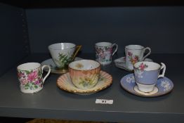 A selection of cabinet cups and saucers to include Victorian conical shaped example