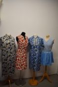 Four 1960s-1970s dresses, including blue silk with ruffle and pleated blue mini dress with lace to