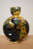 An early 20th century Thomas Forrester & co vase of flask shaped form, having peacock design and