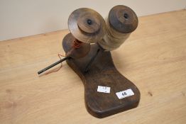 A vintage treen weavers bobbin holder