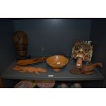 A selection of treen, including African mask, carved and panited oriental dragon mask, turned bowl