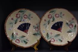 Two Victorian Majolica plates, having moulded decoration of basket weave, with fan to centre, bees