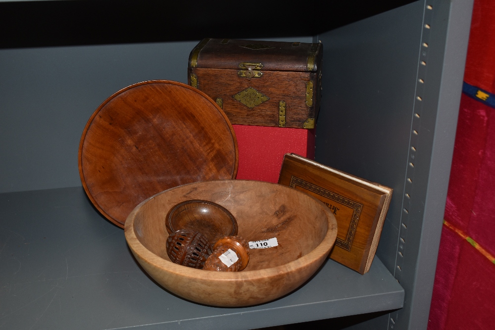 Two antique carved spool holders, a turned cherry wood bowl, a cigar box in the form of a chest,a