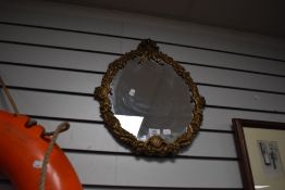 An Edwardian style wall mirror.