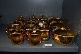 A selection of Royal Worcester porcelain lidded cups and lidded bowls, having full gilt decoration.