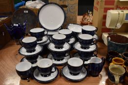 A collection of Denby table ware, having Art Nouveau styling, including plates, cups and saucers