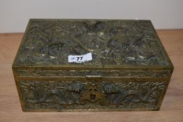 An early 20th Century Chinese brass moulded jewellery box, measuring 10cm x 24cm x 15cm