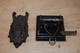 A vintage cast door knocker and a hole punch, stamped Shannon