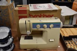 A vintage Brother VX 1300 sewing machine and manual.