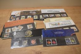 A selection of collectable Royal Mint stamp sets, including sport and transport interest.