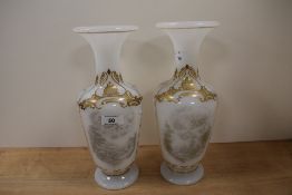 A pair of 19th milk glass vases having transfer decoration with gilt border