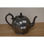 An antique James Dixon & Sons, Sheffield, pewter teapot, of simple form with fancy moulded finial to