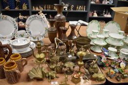 A mixed lot of vintage brass ornaments and four graduated copper jugs.