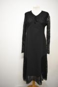 An Art Deco black day dress, having lace panels to skirt and sleeves, with sheers panels